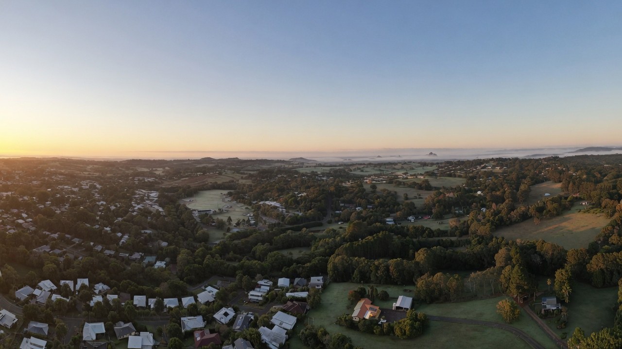 Dawn aerial view of the Sunshine Coast hinterland with the Glass House Mountains on the horizon